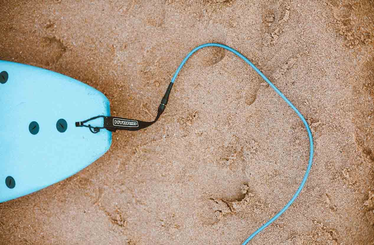 blue surfboard at beach for surfer