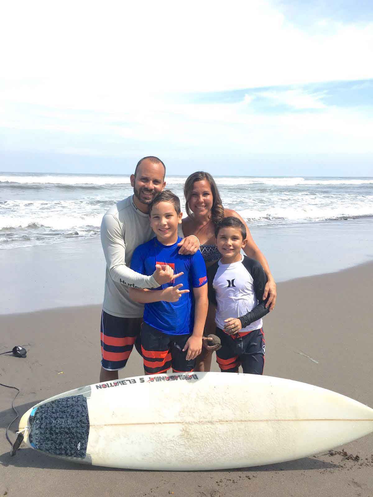 family surfing in bali
