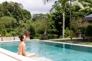 woman enjoy by the pelan bali poolside