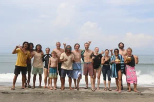 Guests and the Pelan Pelan team celebrating together after a surf session