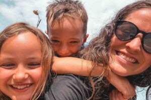 Children laughing during a family surf holiday in Bali