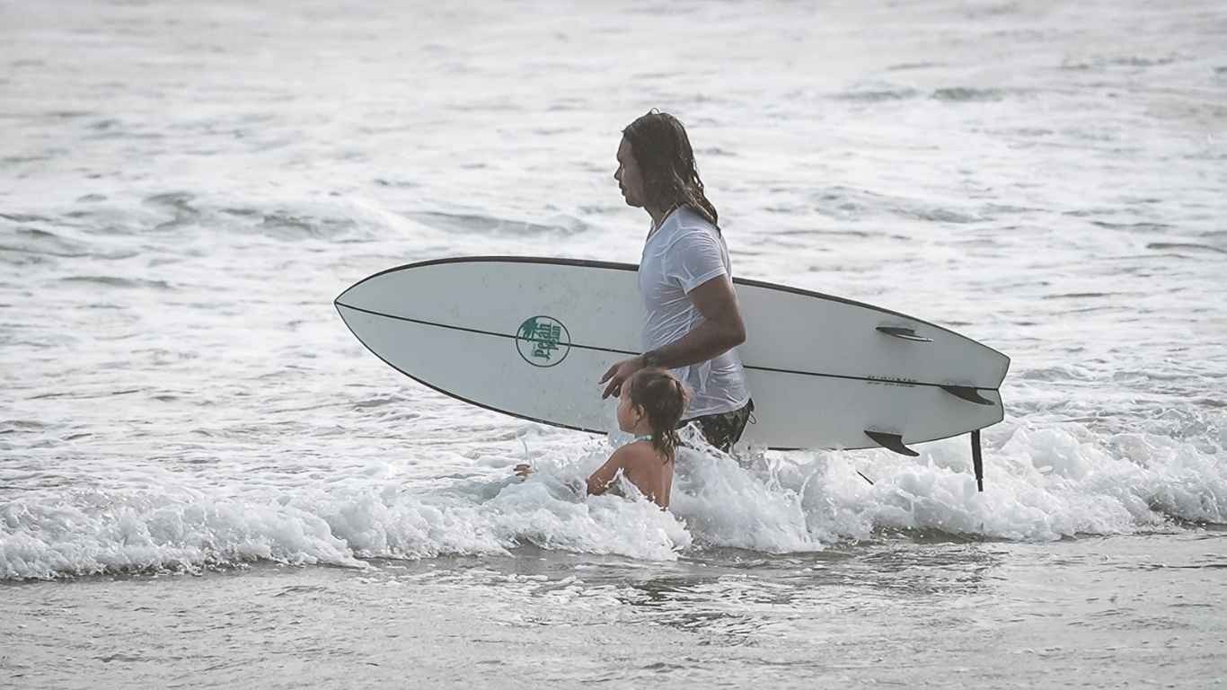 Putu and Luna in the water learning to surf